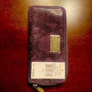 Brand new, never used Michael Kors purple continental genuine leather wallet